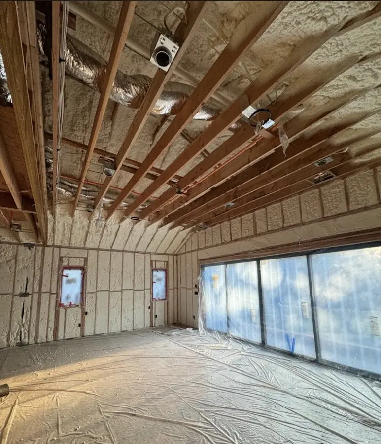 Interior walls and ceiling insulated with spray foam during new construction in Orange